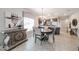 Dining room with a round table, chandelier, and views into the adjacent kitchen at 5450 E Deer Valley Dr # 1186, Phoenix, AZ 85054