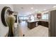 Open concept kitchen with dark wood cabinets, stainless steel appliances, and a breakfast bar at 5450 E Deer Valley Dr # 1186, Phoenix, AZ 85054