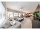 Spacious open concept living room with tiled flooring, comfortable seating and an adjacent dining area at 5450 E Deer Valley Dr # 1186, Phoenix, AZ 85054