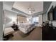 Relax in this main bedroom boasting a ceiling fan, a padded headboard, and neutral decor at 5450 E Deer Valley Dr # 1186, Phoenix, AZ 85054