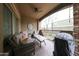 Relax on the covered patio, featuring comfortable seating and a ceiling fan at 5450 E Deer Valley Dr # 1186, Phoenix, AZ 85054