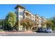 Exterior view of a well-maintained building with manicured landscaping and ample parking at 5450 E Deer Valley Dr # 2023, Phoenix, AZ 85054