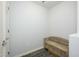 Neutral entryway with a wooden bench and light gray walls, creating a welcoming space at 5450 E Deer Valley Dr # 2023, Phoenix, AZ 85054