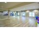 Bright fitness center featuring mirrored walls, wood floors, and ample space for yoga and exercise routines at 5450 E Deer Valley Dr # 2023, Phoenix, AZ 85054