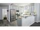 Kitchen with stainless steel appliances, granite countertops, breakfast bar, and tile flooring at 5450 E Deer Valley Dr # 2023, Phoenix, AZ 85054