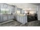 Open concept kitchen with stainless steel appliances, granite countertops, and wood-look tile flooring at 5450 E Deer Valley Dr # 2023, Phoenix, AZ 85054