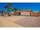Charming single-story home featuring a two-car garage, mature palm trees, and a well-maintained yard at 547 E Sack Dr, Phoenix, AZ 85024