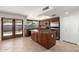 Bright kitchen featuring stainless steel appliances, granite countertops, kitchen island, and tile flooring at 547 E Sack Dr, Phoenix, AZ 85024
