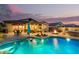Beautiful backyard boasts a refreshing pool, spa, covered patio, and cozy fire pit, ideal for relaxation at 560 W Powell Way, Chandler, AZ 85248