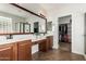 Bathroom showcasing double vanity, large mirror, and convenient access to the walk-in closet at 560 W Powell Way, Chandler, AZ 85248