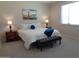 Bright bedroom featuring Golden Gate Bridge art, bedside tables, and plush carpeting for added comfort at 560 W Powell Way, Chandler, AZ 85248