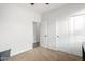 A bedroom with closet space and an open doorway to another room at 560 W Powell Way, Chandler, AZ 85248