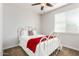 Cozy bedroom with a decorative metal bed frame and a bright window at 560 W Powell Way, Chandler, AZ 85248