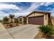 Exterior shot of homes with a two-car garage and desert landscaping at 560 W Powell Way, Chandler, AZ 85248