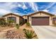 Charming single-story home with a well-manicured front yard and a brick-paved walkway leading to the front door at 560 W Powell Way, Chandler, AZ 85248