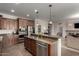 A view of the kitchen island with stainless steel appliances at 560 W Powell Way, Chandler, AZ 85248