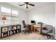 Comfortable home office space with natural light, ceiling fan, and functional work area at 560 W Powell Way, Chandler, AZ 85248