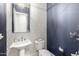 Stylish powder room with decorative wallpaper, elegant fixtures, and a modern sink at 6112 E Calle De Pompas --, Cave Creek, AZ 85331