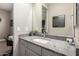 Bathroom featuring a granite countertop, ceramic sink, framed mirror, and modern decor at 6112 E Calle De Pompas --, Cave Creek, AZ 85331