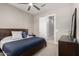 Neutral bedroom with a ceiling fan, a carpet floor, and a wood frame bed at 6112 E Calle De Pompas --, Cave Creek, AZ 85331