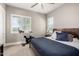 Bright bedroom with a ceiling fan, large windows, exercise bike, and neutral walls at 6112 E Calle De Pompas --, Cave Creek, AZ 85331