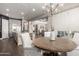 Bright dining area adjacent to the kitchen, showcasing a chandelier and natural light at 6112 E Calle De Pompas --, Cave Creek, AZ 85331