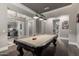 Stylish game room boasting a pool table, modern lighting, hardwood floors, and neutral paint colors at 6112 E Calle De Pompas --, Cave Creek, AZ 85331