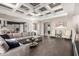 Open-concept living area with hardwood floors, decorative ceilings, and seamless flow to the kitchen at 6112 E Calle De Pompas --, Cave Creek, AZ 85331