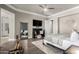 Spacious main bedroom with wood floors, a full length mirror, and a home gym area at 6112 E Calle De Pompas --, Cave Creek, AZ 85331