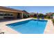 Backyard pool with a patio area and comfortable blue lounge chairs for relaxing by the water at 6112 E Calle De Pompas --, Cave Creek, AZ 85331