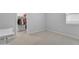Neat bedroom with desk, carpet flooring, and closet at 696 W Glen Canyon Dr, San Tan Valley, AZ 85140