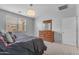 Bedroom featuring a dresser with mirror next to a window and bed at 696 W Glen Canyon Dr, San Tan Valley, AZ 85140