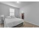 Bright bedroom with white bedding and a view into a walk-in closet at 696 W Glen Canyon Dr, San Tan Valley, AZ 85140
