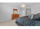 Bedroom with a dresser and mirror and a bed with black bedding at 696 W Glen Canyon Dr, San Tan Valley, AZ 85140