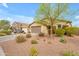 Street view of a single-story home featuring desert landscaping and an attached two-car garage at 696 W Glen Canyon Dr, San Tan Valley, AZ 85140