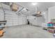 Spacious and organized three car garage featuring storage solutions for vehicles and household items at 696 W Glen Canyon Dr, San Tan Valley, AZ 85140