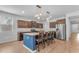 Kitchen with stainless steel appliances, wood cabinets, granite countertops and a large center island at 696 W Glen Canyon Dr, San Tan Valley, AZ 85140