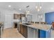 Kitchen featuring stainless steel appliances, wood cabinets, granite countertops and a center island at 696 W Glen Canyon Dr, San Tan Valley, AZ 85140