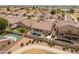 Aerial view of a desert home with a private pool, covered patio, and desert landscaping at 760 W Douglas Ave, Gilbert, AZ 85233