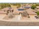 Aerial view of single Gathering home featuring a three car garage and solar panels on the roof at 760 W Douglas Ave, Gilbert, AZ 85233