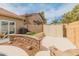 This backyard features a stone retaining wall, gravel accents, and a small patch of artificial turf at 760 W Douglas Ave, Gilbert, AZ 85233
