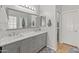 Bathroom features double sinks, a large mirror, and a separate toilet room at 760 W Douglas Ave, Gilbert, AZ 85233