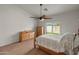 Bright bedroom with a ceiling fan and sliding door access to the outdoor space at 760 W Douglas Ave, Gilbert, AZ 85233
