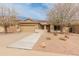 Inviting single-story home with desert landscaping, a tile roof, and walkway leading to a covered porch at 760 W Douglas Ave, Gilbert, AZ 85233