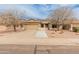 Charming single-story home boasts a tile roof, desert landscaping, and solar panels for energy efficiency at 760 W Douglas Ave, Gilbert, AZ 85233
