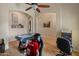 Inviting game room with air hockey, retro arcade game, ceiling fan, and decorative details at 760 W Douglas Ave, Gilbert, AZ 85233