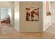 Inviting hallway showcases wood-look flooring and an open doorway to the home's bedroom at 760 W Douglas Ave, Gilbert, AZ 85233