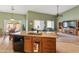 Kitchen with island, dining area, and a view of the open concept living area at 760 W Douglas Ave, Gilbert, AZ 85233