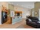 Eat-in kitchen with a large island, oak cabinetry, and stainless appliances at 760 W Douglas Ave, Gilbert, AZ 85233