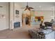 Living Room with fireplace, vaulted ceiling, and an open floorplan view of the kitchen at 760 W Douglas Ave, Gilbert, AZ 85233